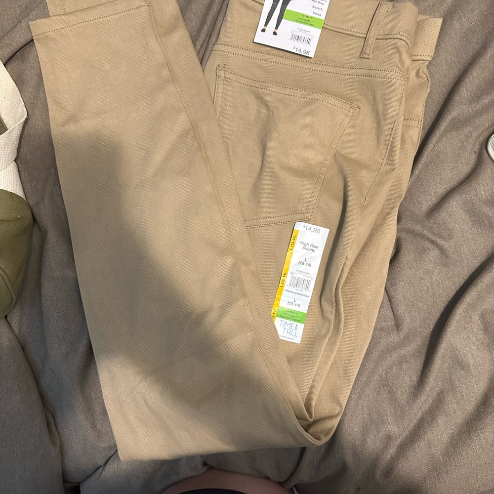 2 pairs of high-rise, skinny jeggings. Size large. A tan pair, and a green pair.